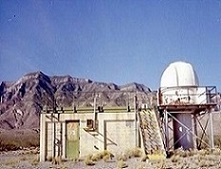 A early 1950s instrumentation site at White Sands Missile Range. The cinder block building is an elevated cinethedolite shelter (photographic instruments) 